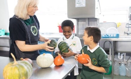 Ali, left, and Zuriel sample the squashes grown in the kitchen at Greenside primary school.
